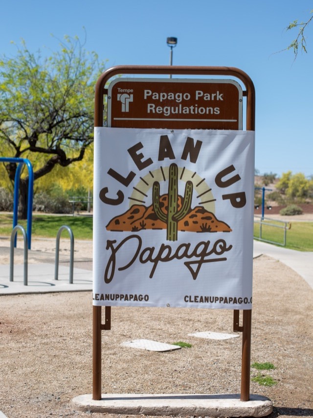 A Clean Up Papago banner on a park sign at Papago Park in Arizona