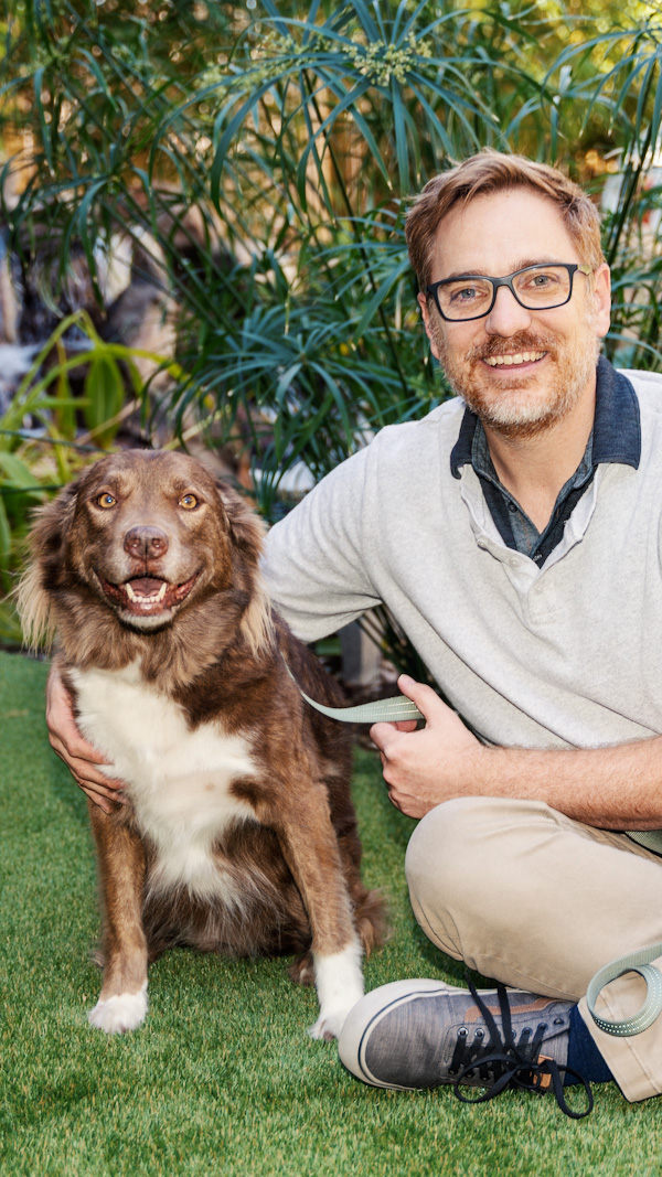 A Proctorio employee outside with his dog